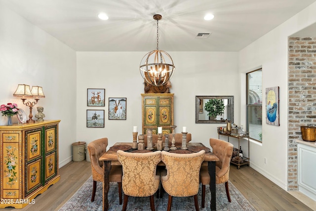 10799 E Florence Way, Scottsdale, AZ 85262 - dining room with light wood-style floors, visible vents, baseboards, and an inviting chandelier