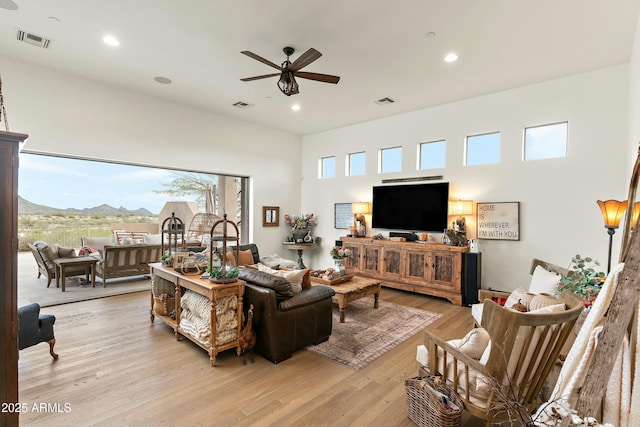 10799 E Florence Way, Scottsdale, AZ 85262 - living room featuring light wood-type flooring, a ceiling fan, visible vents, and recessed lighting