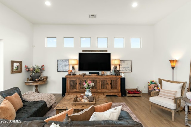 10799 E Florence Way, Scottsdale, AZ 85262 - living room with visible vents, baseboards, recessed lighting, and wood finished floors