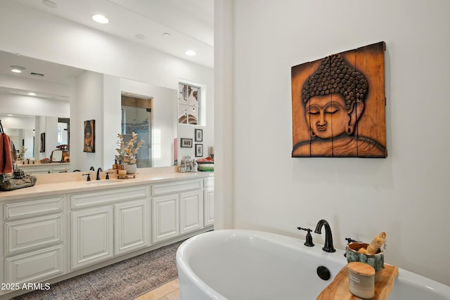 10799 E Florence Way, Scottsdale, AZ 85262 - bathroom featuring vanity, recessed lighting, visible vents, a freestanding bath, and a shower with shower door