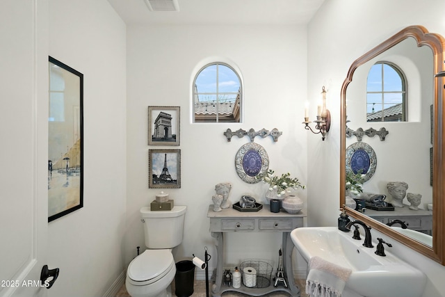 10799 E Florence Way, Scottsdale, AZ 85262 - bathroom with visible vents, toilet, and baseboards