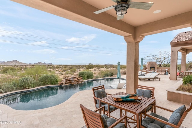10799 E Florence Way, Scottsdale, AZ 85262 - view of swimming pool with a fenced in pool, a patio, a mountain view, outdoor dining area, and ceiling fan