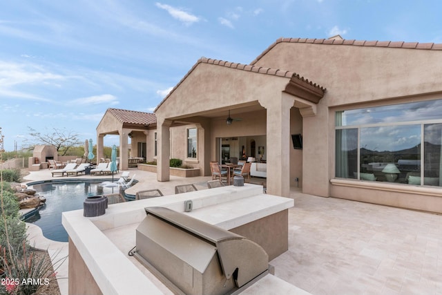 10799 E Florence Way, Scottsdale, AZ 85262 - view of patio / terrace with outdoor dining space, an outdoor hangout area, a fenced in pool, and a ceiling fan
