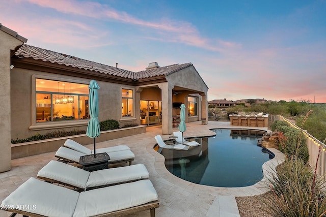 10799 E Florence Way, Scottsdale, AZ 85262 - pool at dusk featuring a fenced in pool and a patio