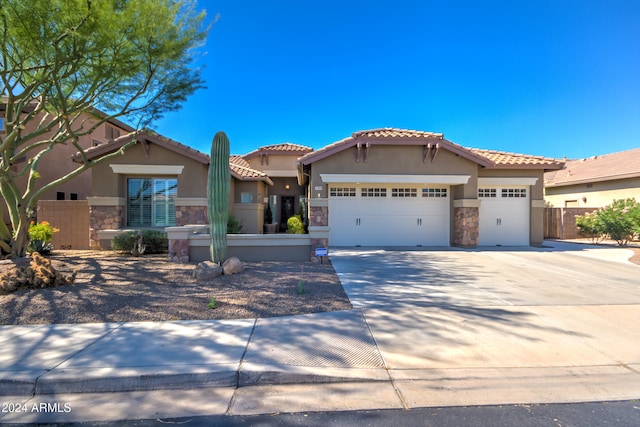 mediterranean / spanish-style home featuring a garage