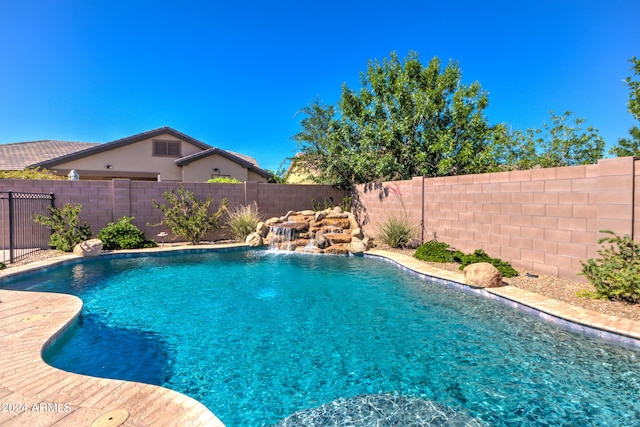 view of pool with pool water feature