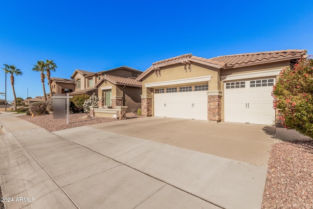 view of front of property with a garage