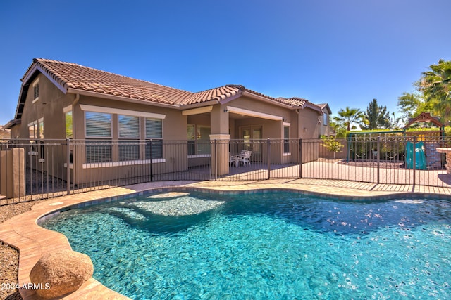 view of swimming pool with a patio area