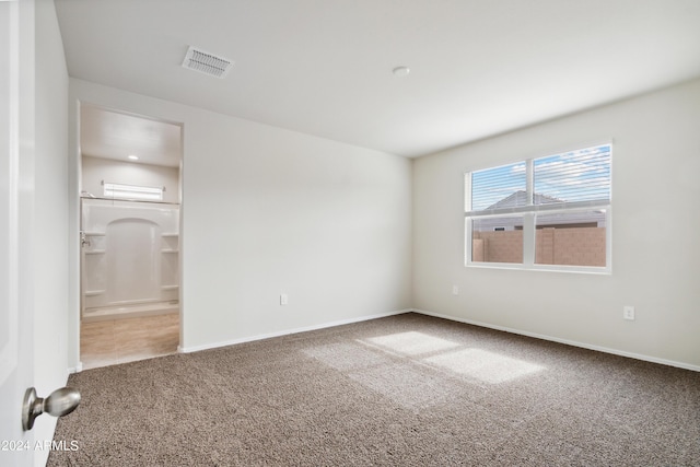 5516 E Mearn Rd, San Tan Valley, AZ 85140 - unfurnished bedroom featuring carpet flooring, baseboards, and ensuite bathroom