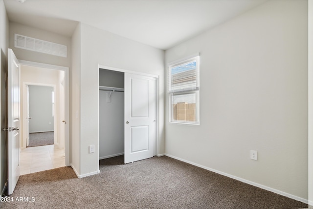 5516 E Mearn Rd, San Tan Valley, AZ 85140 - unfurnished bedroom with carpet flooring, baseboards, and a closet
