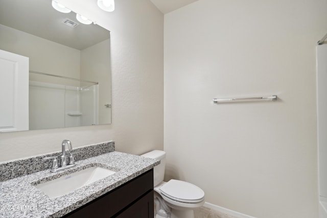5516 E Mearn Rd, San Tan Valley, AZ 85140 - bathroom featuring toilet, vanity, and a shower