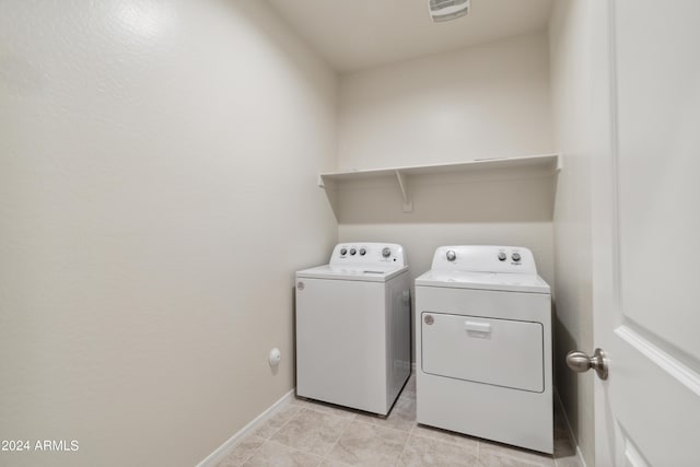 5516 E Mearn Rd, San Tan Valley, AZ 85140 - laundry room with separate washer and dryer, baseboards, and light tile patterned floors