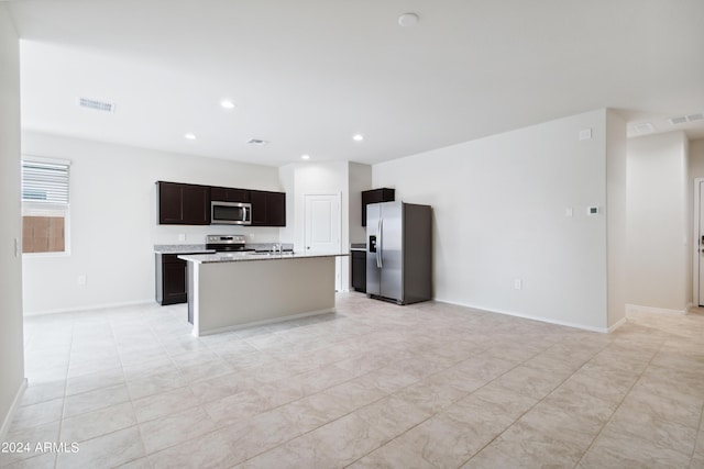 5516 E Mearn Rd, San Tan Valley, AZ 85140 - kitchen featuring stainless steel appliances, open floor plan, light countertops, a kitchen island with sink, and recessed lighting