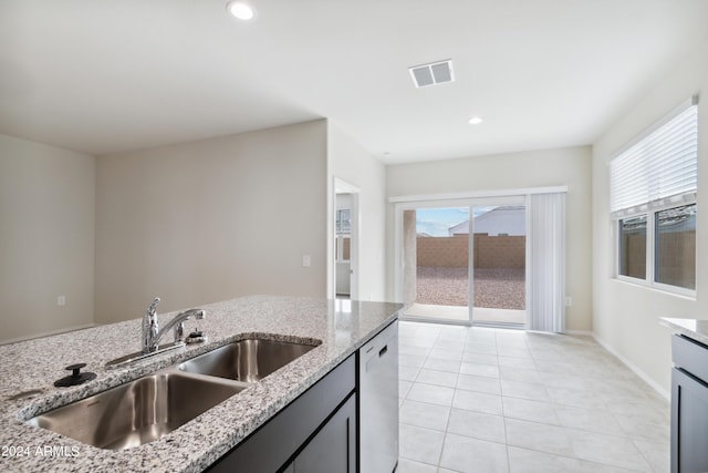 5516 E Mearn Rd, San Tan Valley, AZ 85140 - kitchen with a sink, dishwasher, light stone countertops, light tile patterned flooring, and recessed lighting
