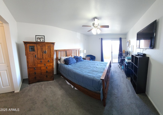 bedroom with ceiling fan and dark colored carpet