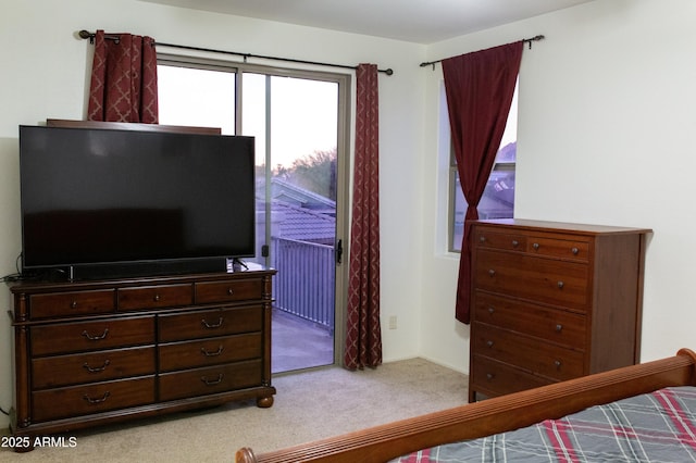 bedroom featuring light colored carpet