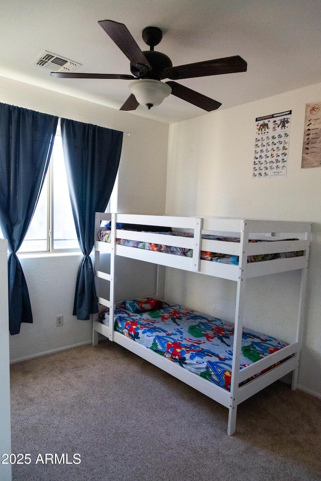 bedroom with ceiling fan and carpet