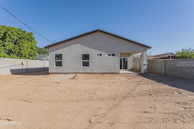9310 W Washington St, Tolleson, AZ 85353 - back of house featuring a fenced backyard, a patio area, and stucco siding