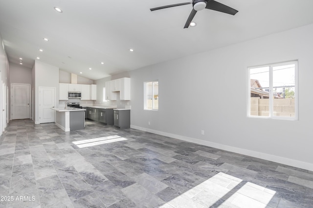 9310 W Washington St, Tolleson, AZ 85353 - unfurnished living room featuring ceiling fan, recessed lighting, baseboards, and high vaulted ceiling