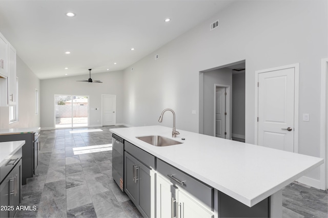 9310 W Washington St, Tolleson, AZ 85353 - kitchen with a sink, stainless steel dishwasher, vaulted ceiling, ceiling fan, and light countertops