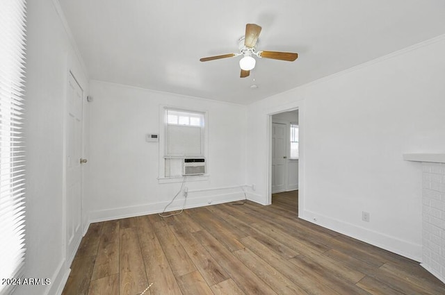 unfurnished room with baseboards, ornamental molding, hardwood / wood-style floors, cooling unit, and a ceiling fan