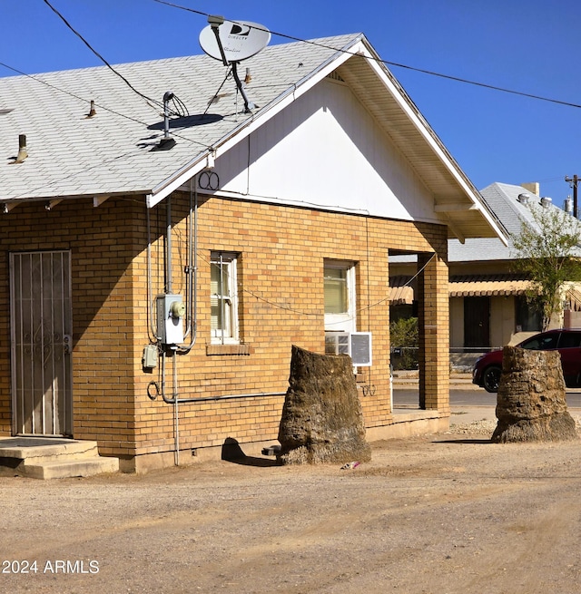 exterior space featuring brick siding