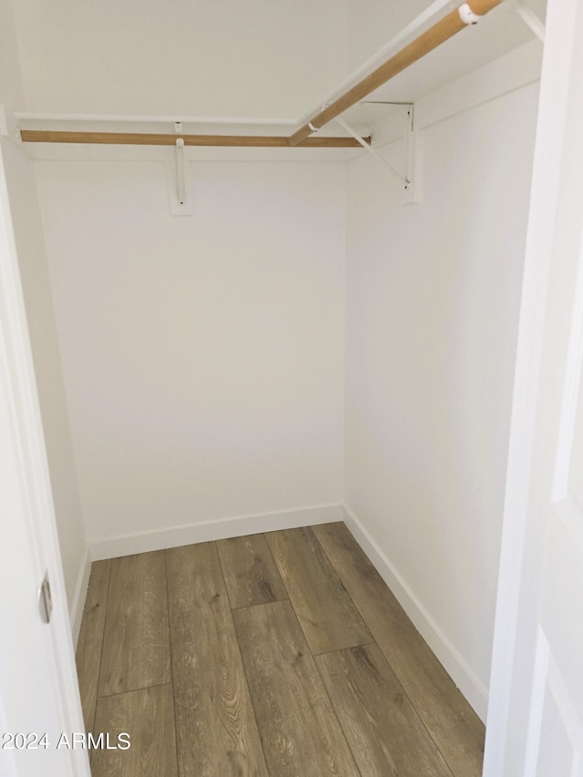 walk in closet featuring hardwood / wood-style floors