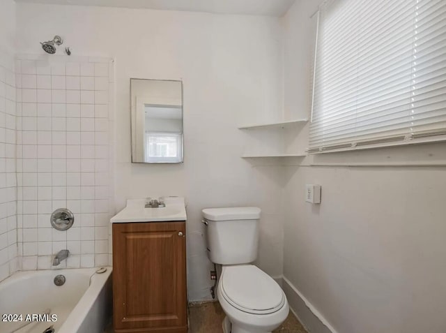 bathroom featuring baseboards, toilet,  shower combination, and vanity