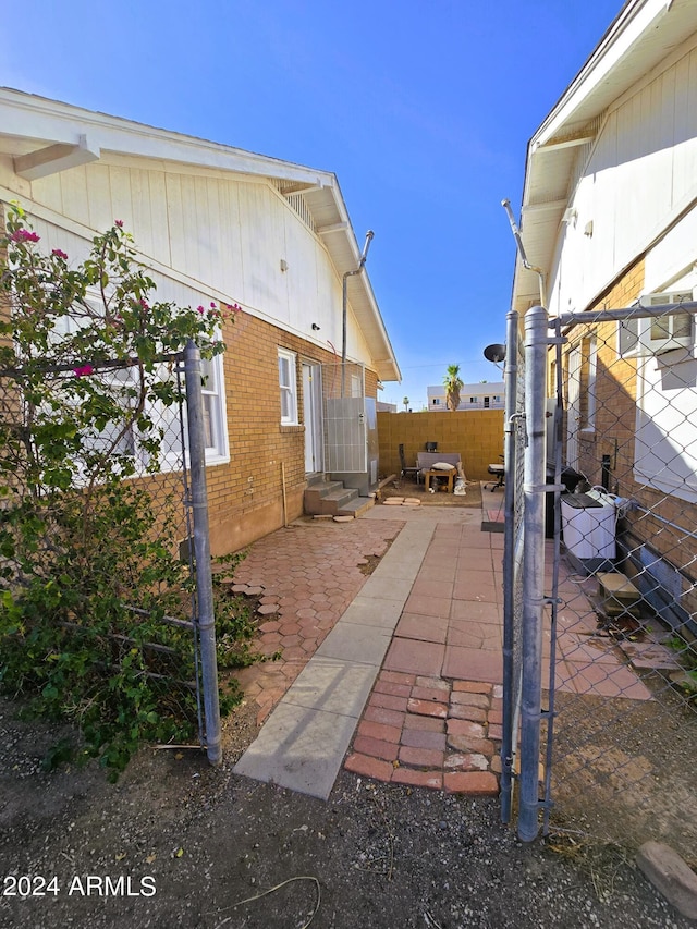 view of patio featuring entry steps and fence