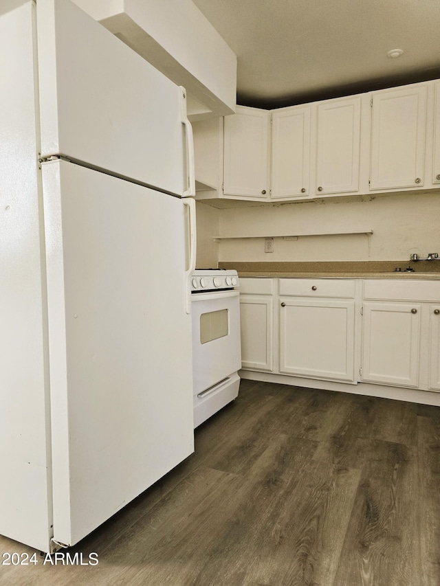 kitchen with white cabinetry, white appliances, and dark wood-type flooring