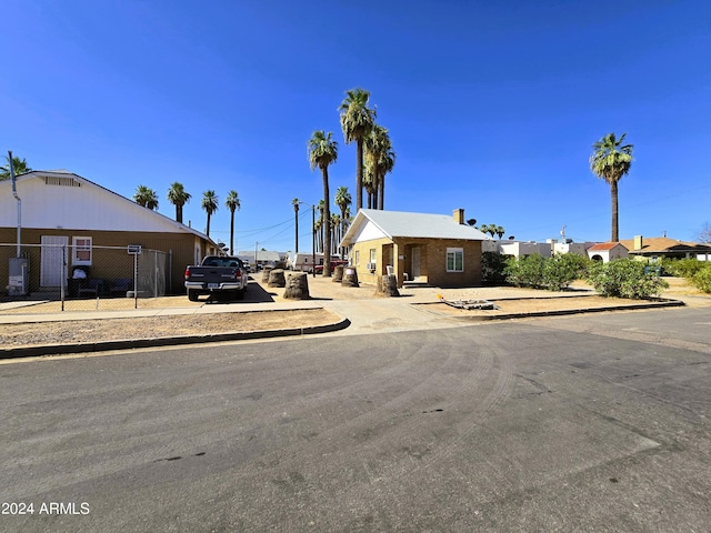 view of front of property featuring fence