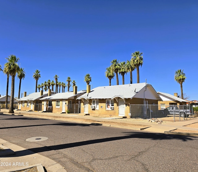 single story home with fence and a residential view