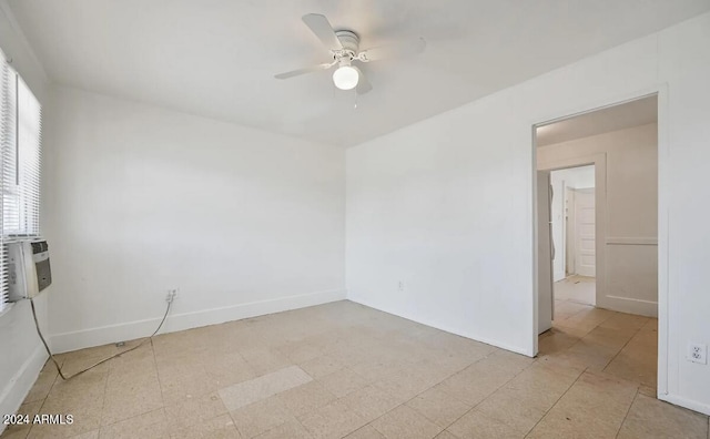 empty room with baseboards and ceiling fan