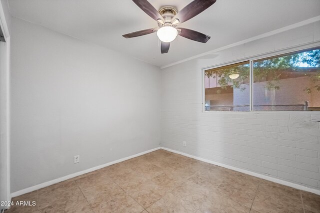 unfurnished room with ceiling fan