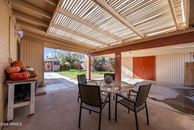 view of patio / terrace featuring a shed