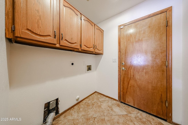 washroom featuring electric dryer hookup, cabinet space, light tile patterned flooring, baseboards, and hookup for a washing machine