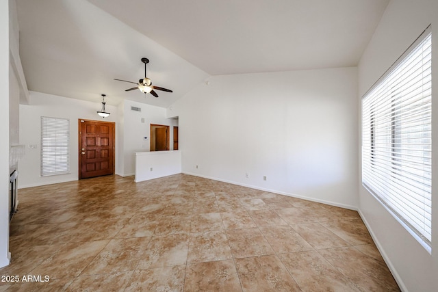 unfurnished living room featuring visible vents, baseboards, ceiling fan, and vaulted ceiling