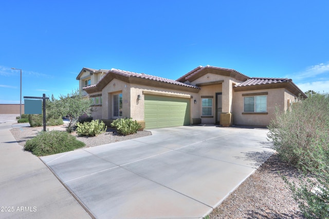17743 N Rosa Dr, Maricopa, AZ 85138 - mediterranean / spanish home featuring stucco siding, a tile roof, a garage, and driveway
