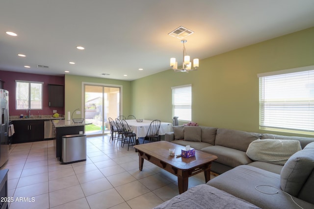 17743 N Rosa Dr, Maricopa, AZ 85138 - living area with light tile patterned flooring, visible vents, recessed lighting, and a chandelier