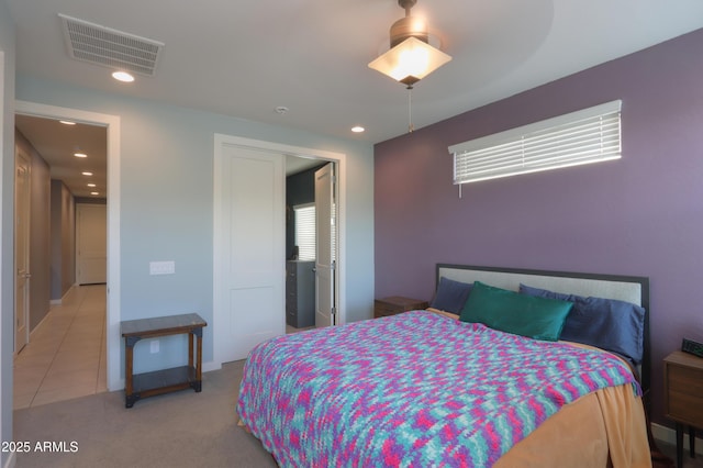 17743 N Rosa Dr, Maricopa, AZ 85138 - bedroom featuring visible vents, recessed lighting, light tile patterned floors, and light colored carpet