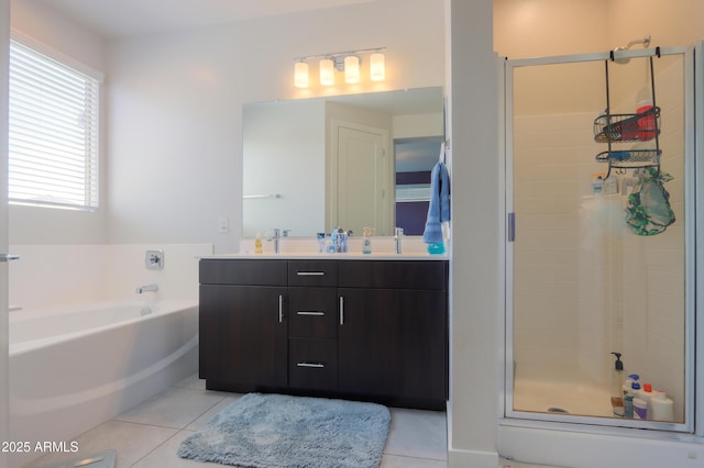 17743 N Rosa Dr, Maricopa, AZ 85138 - bathroom with a shower stall, double vanity, a sink, a garden tub, and tile patterned flooring