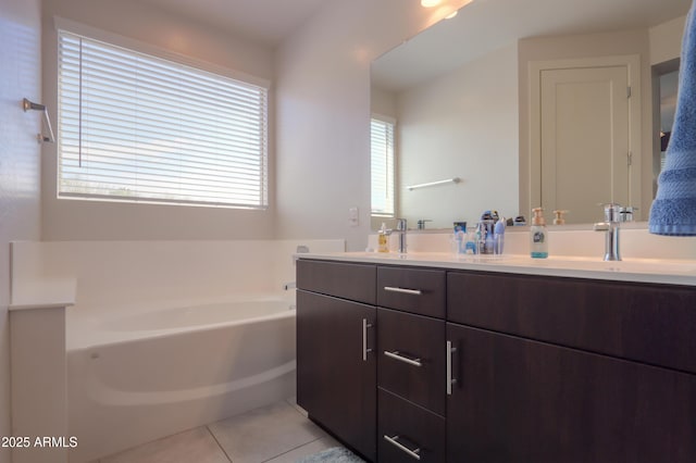 17743 N Rosa Dr, Maricopa, AZ 85138 - bathroom with tile patterned flooring, double vanity, a sink, and a bath