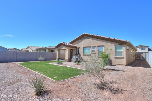 17743 N Rosa Dr, Maricopa, AZ 85138 - back of property featuring a fenced backyard, stucco siding, a yard, and central air condition unit