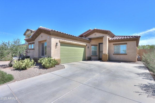 17743 N Rosa Dr, Maricopa, AZ 85138 - mediterranean / spanish-style home with stucco siding, a tiled roof, a garage, and concrete driveway