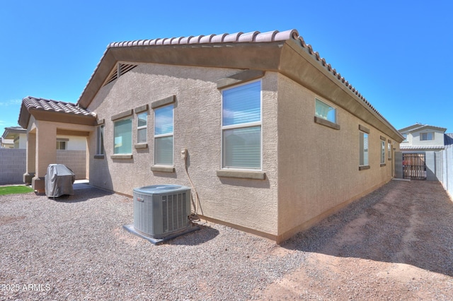 17743 N Rosa Dr, Maricopa, AZ 85138 - back of property with central air condition unit, a tile roof, stucco siding, and fence