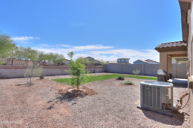 17743 N Rosa Dr, Maricopa, AZ 85138 - view of yard featuring central AC unit and a fenced backyard