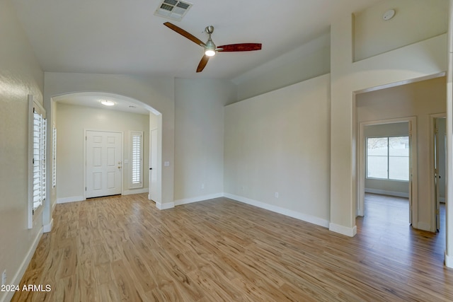 empty room with light wood-type flooring and ceiling fan