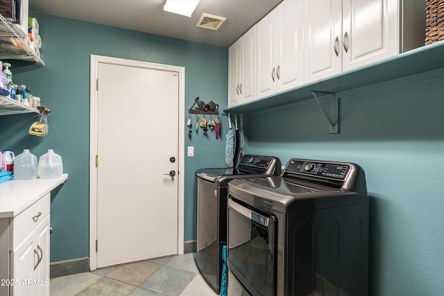 6326 W Misty Willow Ln, Glendale, AZ 85310 - washroom with washing machine and dryer, cabinet space, and baseboards
