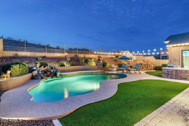 6326 W Misty Willow Ln, Glendale, AZ 85310 - pool at twilight featuring a patio