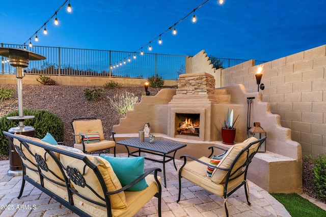 6326 W Misty Willow Ln, Glendale, AZ 85310 - fenced backyard featuring a patio and an outdoor living space with a fireplace